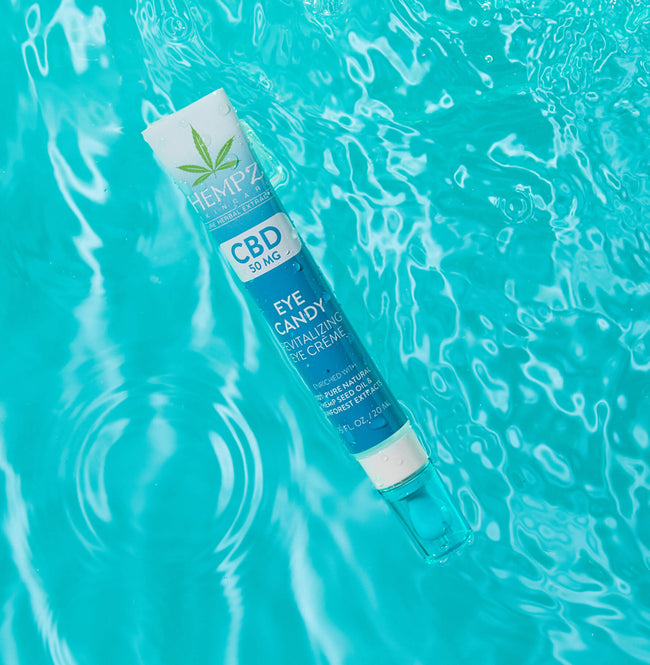Hempz CBD Eye Candy Revitalizing Eye Creme floating in water